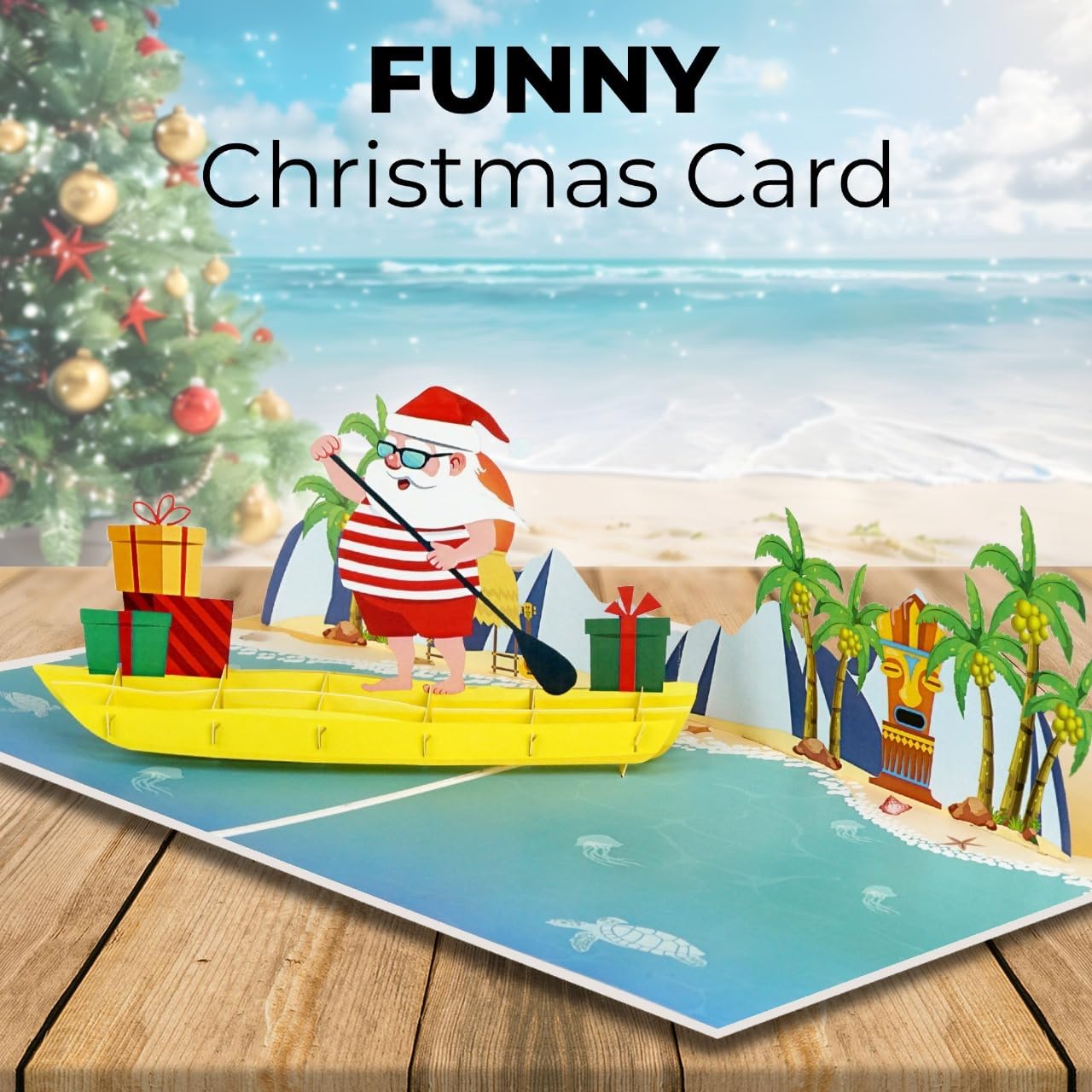 iGifts And Cards Tropical Santa 3D Pop Up Christmas Card - Warm Wishes from Down Under! Funny Beach Holiday Greeting with Santa Rowing a Canoe Full of Gifts – 6" x 8" with Notecard and Envelope