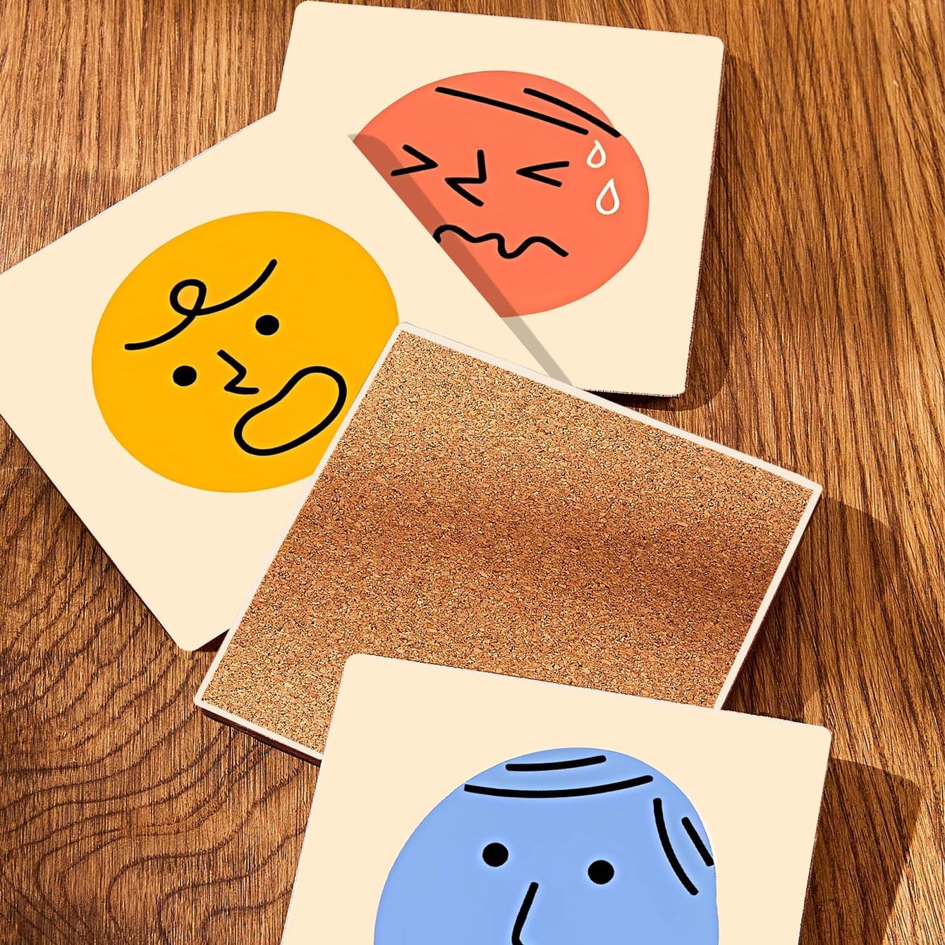 MAYCARI Cartoon Emotional Face Coasters Set of 6 Cork Backed Cute Coasters with Metal Holder Original Ceramic Surface Drink Cup Mats for Tabletop Protection Modern Desk Decoration Birthday Gifts