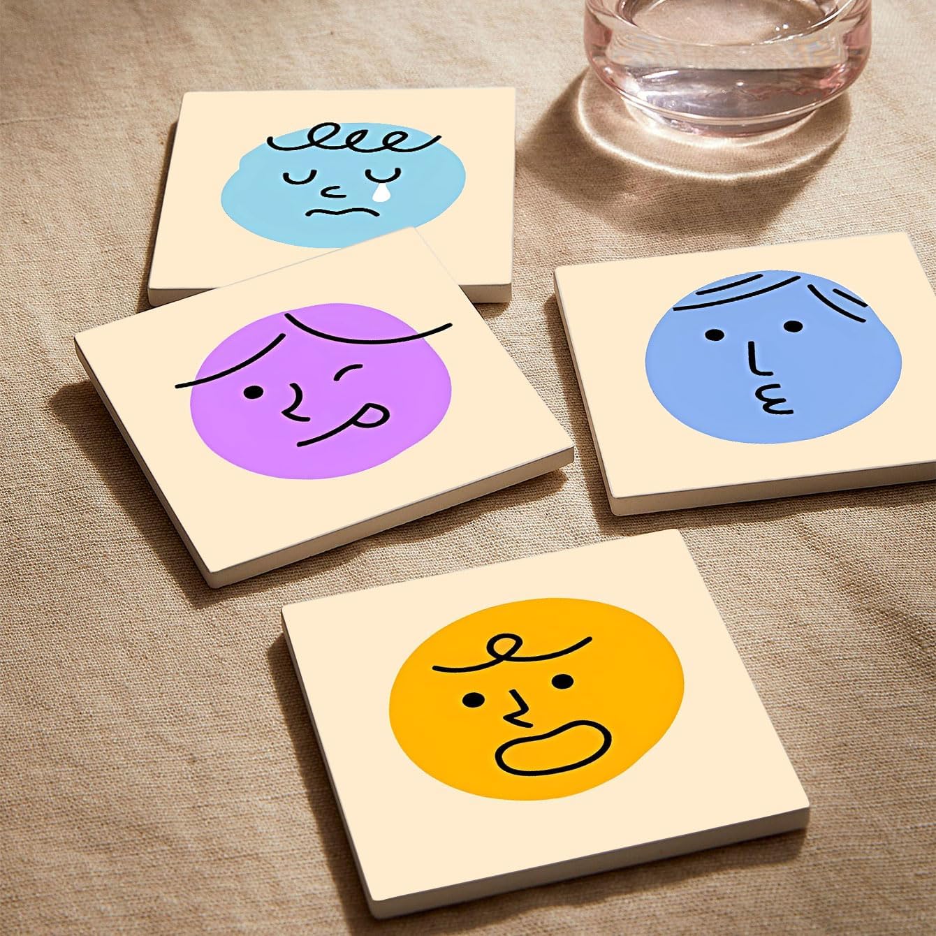 MAYCARI Cartoon Emotional Face Coasters Set of 6 Cork Backed Cute Coasters with Metal Holder Original Ceramic Surface Drink Cup Mats for Tabletop Protection Modern Desk Decoration Birthday Gifts